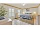Bedroom with tile flooring, ceiling fan, and windows with shutters at 704 Pinnacle Dr, Haines City, FL 33844