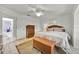 Bedroom featuring tile floors, a ceiling fan, and wooden furniture at 704 Pinnacle Dr, Haines City, FL 33844
