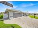 Single-story home with a large two-car garage and paved driveway at 704 Pinnacle Dr, Haines City, FL 33844