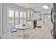 Bright kitchen featuring white cabinets and countertops, complemented by tiled floors at 704 Pinnacle Dr, Haines City, FL 33844