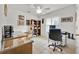 Home office featuring tile floors, white walls, and a ceiling fan at 704 Pinnacle Dr, Haines City, FL 33844