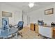 Home office featuring tile floors, white walls, and a ceiling fan at 704 Pinnacle Dr, Haines City, FL 33844
