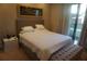 Bedroom with large bed, a window, and seating at 7465 Bleecker Ln, Kissimmee, FL 34747