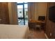 Bedroom with desk, window, and warm tones at 7465 Bleecker Ln, Kissimmee, FL 34747