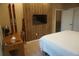 Bedroom featuring a wood accent wall, wooden desk, and decorative skis displayed on the wall at 7465 Bleecker Ln, Kissimmee, FL 34747