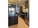 Bright kitchen showcasing a large island with bar seating, stainless appliances, and an open floor plan at 7465 Bleecker Ln, Kissimmee, FL 34747