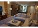 Spacious living room featuring modern decor, plush seating, and an open layout leading to the kitchen at 7465 Bleecker Ln, Kissimmee, FL 34747