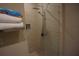 Modern shower with chevron patterned tile and a rainfall shower head at 7465 Bleecker Ln, Kissimmee, FL 34747