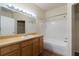 Well-lit bathroom features a large mirror, vanity, and a shower-tub combination at 9117 Lee Vista Blvd # 603, Orlando, FL 32829
