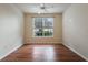 Bright bedroom with hardwood floors, ceiling fan, and a window providing natural light at 9117 Lee Vista Blvd # 603, Orlando, FL 32829