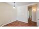 A well-lit dining area with wood floors located close to the bathroom at 9117 Lee Vista Blvd # 603, Orlando, FL 32829