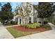 Charming townhome showcasing manicured landscaping, an attractive exterior, and a welcoming entrance at 9117 Lee Vista Blvd # 603, Orlando, FL 32829