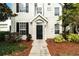 Inviting front entrance with a black door, well-maintained landscaping, and a clear address display at 9117 Lee Vista Blvd # 603, Orlando, FL 32829