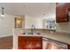 Close-up of a kitchen sink with stainless steel appliances and stylish cabinetry at 9117 Lee Vista Blvd # 603, Orlando, FL 32829