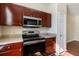 Modern kitchen boasting stainless steel appliances, updated cabinets, and sleek countertops at 9117 Lee Vista Blvd # 603, Orlando, FL 32829