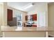 Bright kitchen features stainless steel appliances, countertops, and a breakfast bar with natural lighting at 9117 Lee Vista Blvd # 603, Orlando, FL 32829