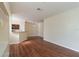 Spacious open floor plan blending living and kitchen areas with sleek wood flooring and ample light at 9117 Lee Vista Blvd # 603, Orlando, FL 32829