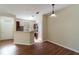 Bright living area flowing into a kitchen with a breakfast bar, perfect for modern living at 9117 Lee Vista Blvd # 603, Orlando, FL 32829