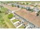 Aerial view of neighborhood townhomes with cozy patios, partial fences, and lovely landscaping at 9161 Shepton St, Orlando, FL 32825