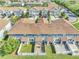 Aerial view of townhomes boasting tidy patios, partial fences, and charming green landscaping at 9161 Shepton St, Orlando, FL 32825