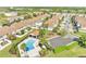 Aerial view showcasing community pool, playground, parking, landscaping, and neighboring townhomes at 9161 Shepton St, Orlando, FL 32825