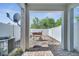 Brick-floored backyard with a grill with a white fence, a satellite dish, and an AC unit at 9161 Shepton St, Orlando, FL 32825