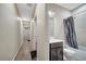 Hallway bathroom with a vanity, shower and tub combination with neutral color palette at 9161 Shepton St, Orlando, FL 32825