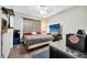 Bedroom with laminate flooring, ceiling fan and TV screen displaying a relaxing beach scene at 9161 Shepton St, Orlando, FL 32825