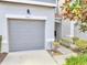 Attached single-car garage showcasing a modern panel door with house number 9161 at 9161 Shepton St, Orlando, FL 32825