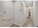 Hallway with laminate flooring leading to room with storage closet at 9161 Shepton St, Orlando, FL 32825