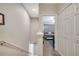 Hallway view leading to a bedroom, showcasing the neutral tones and door to closet at 9161 Shepton St, Orlando, FL 32825