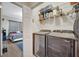 Convenient laundry room with washer, dryer, and shelving for optimal storage at 9161 Shepton St, Orlando, FL 32825