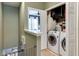 Convenient laundry area featuring modern washer and dryer units and functional storage at 9189 Shepton St, Orlando, FL 32825