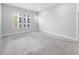 This large bedroom has carpeted floors, neutral paint, three large windows for ample natural light at 936 Wild Date Ln, Lake Mary, FL 32746