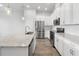Contemporary kitchen with stainless steel appliances, granite countertops, ample storage, and modern fixtures for culinary enthusiasts at 936 Wild Date Ln, Lake Mary, FL 32746