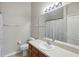 Well-lit bathroom featuring a sizable mirror above the vanity and a toilet at 104 Wilton Cir, Sanford, FL 32773