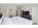 Bright bedroom showcasing a neutral color scheme, bathroom access, and closet at 104 Wilton Cir, Sanford, FL 32773