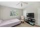 Bedroom view showing the window, bed, and television at 104 Wilton Cir, Sanford, FL 32773