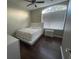 Bright bedroom with modern, light wood furniture and large window at 117 Anzio Dr, Kissimmee, FL 34758