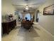 Spacious dining room with tiled floors, decorative window treatments, and modern furnishings at 117 Anzio Dr, Kissimmee, FL 34758