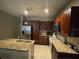 Well-lit kitchen with stainless steel appliances and granite countertops at 117 Anzio Dr, Kissimmee, FL 34758