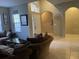 Open-concept living room features neutral walls, and tile floors at 117 Anzio Dr, Kissimmee, FL 34758