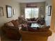 Comfortable living room with tile floors, neutral paint, and modern decor at 117 Anzio Dr, Kissimmee, FL 34758
