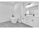 Luxurious bathroom featuring a freestanding tub, double vanity, and modern fixtures at 13584 Sw 43Rd Cir, Ocala, FL 34473
