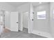 Modern bathroom with tiled walk-in shower, glass door, and neutral color palette at 13584 Sw 43Rd Cir, Ocala, FL 34473
