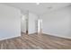 Light-filled bedroom with an open doorway and light wood floors at 13584 Sw 43Rd Cir, Ocala, FL 34473