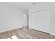 Bedroom featuring wood-look flooring and a double door closet at 13584 Sw 43Rd Cir, Ocala, FL 34473