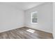 Cozy bedroom with natural light and wood-look flooring at 13584 Sw 43Rd Cir, Ocala, FL 34473