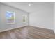 Bright bedroom filled with natural light from two large windows and light wood floors at 13584 Sw 43Rd Cir, Ocala, FL 34473