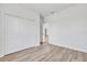 Bright bedroom features wood-look floors and a spacious closet with bi-fold doors at 13584 Sw 43Rd Cir, Ocala, FL 34473
